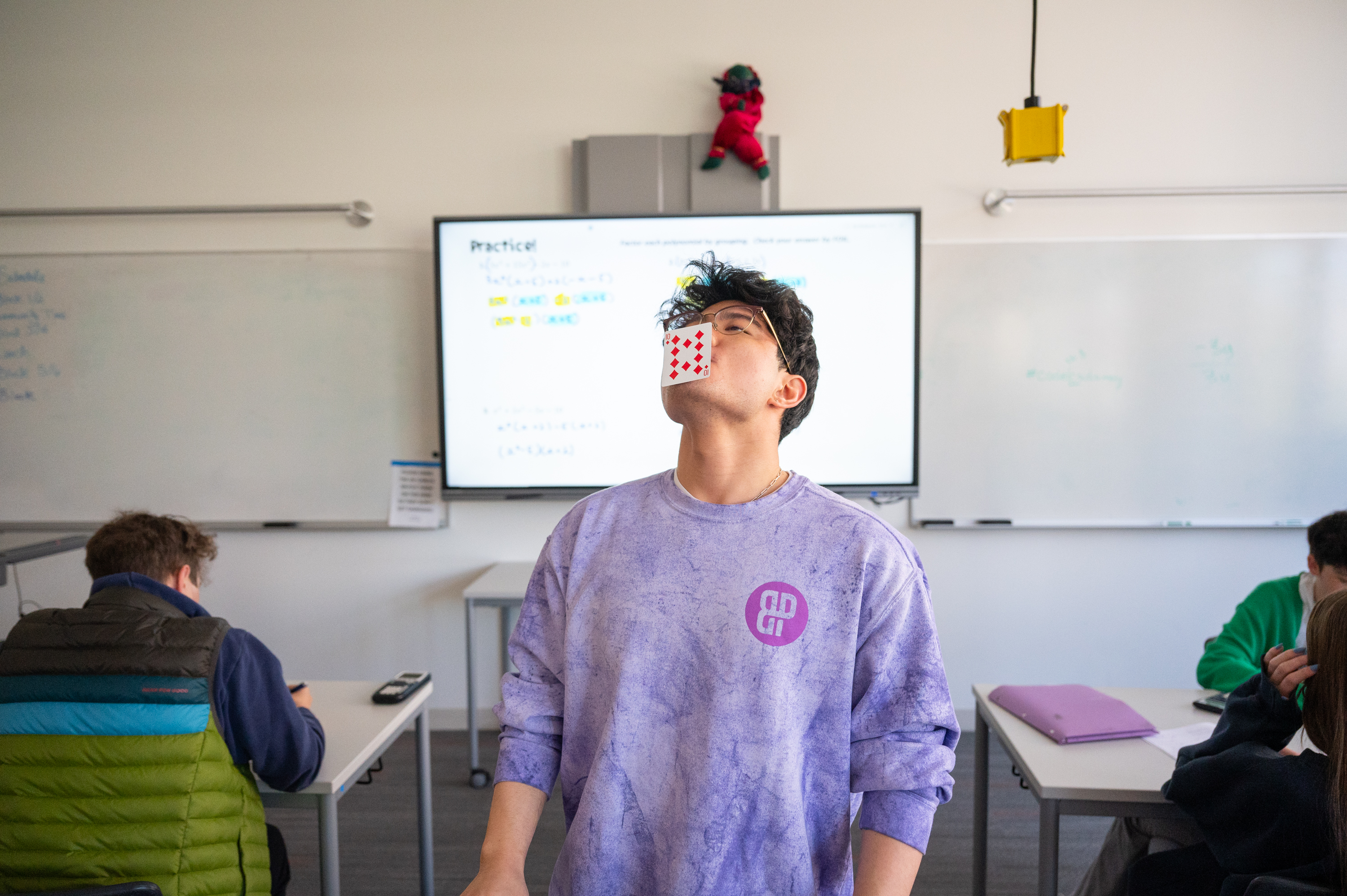 Travis doing a card trick for his class